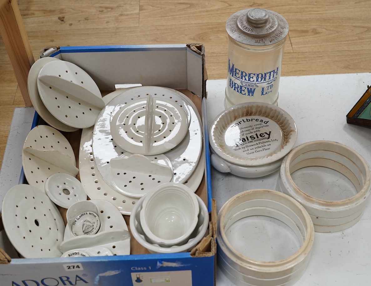 A quantity of Victorian and later kitchenalia and advertising ware, to include a Meredith & Drew Ltd. biscuit jar, sieve dishes etc. Condition - poor to fair